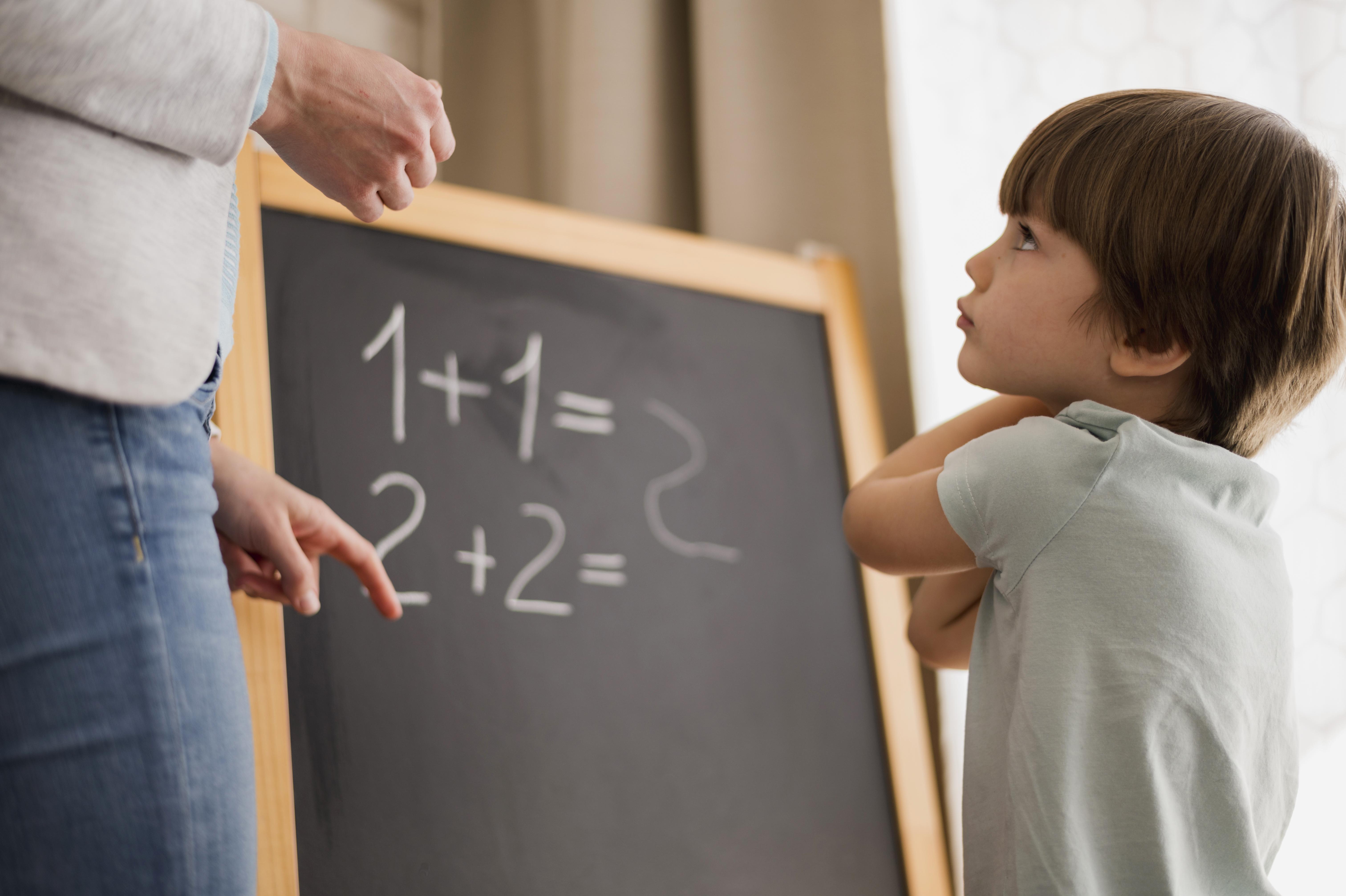 side-view-child-home-being-taught-mathematics